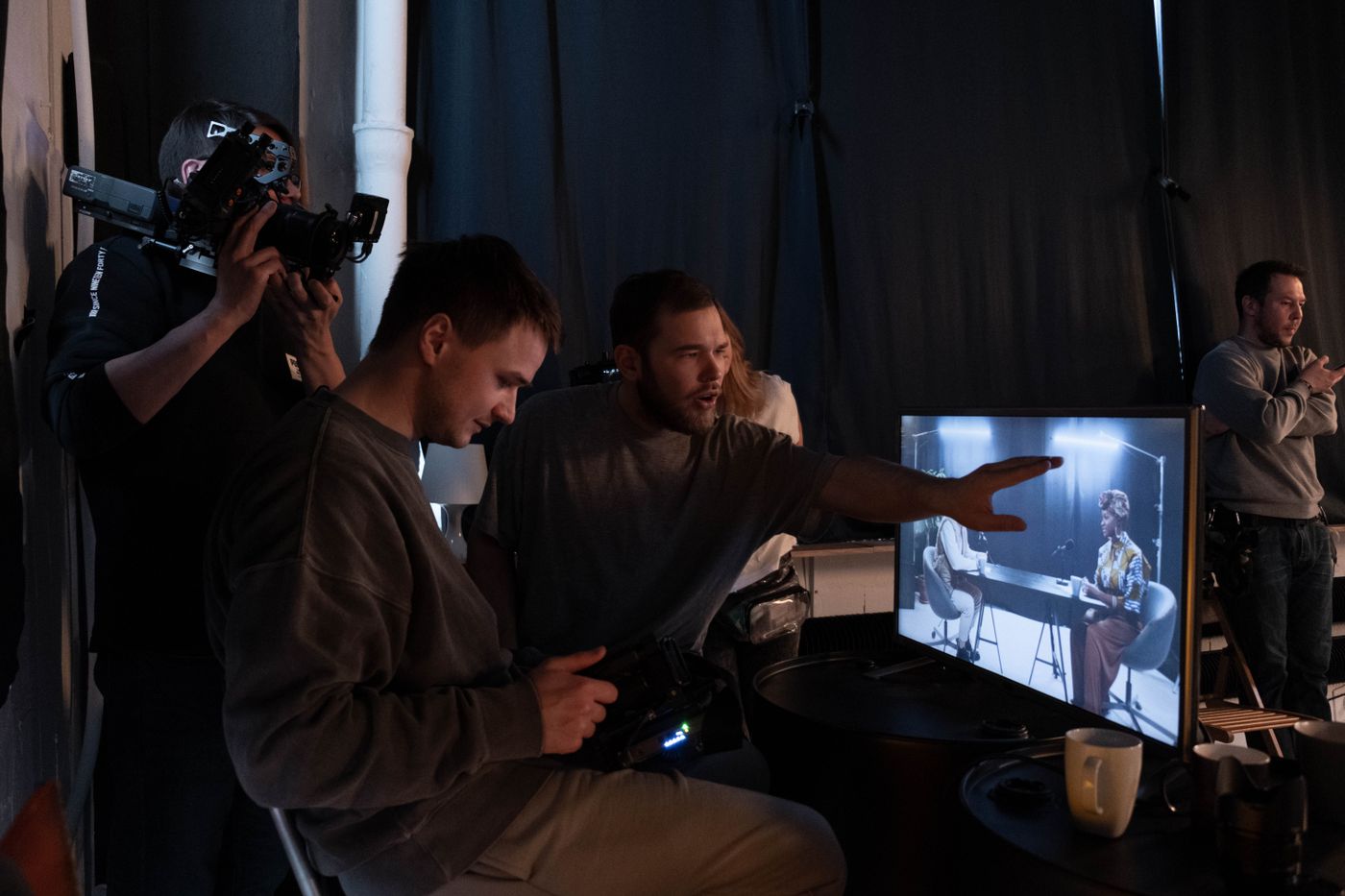 Creative production team working together in a recording studio